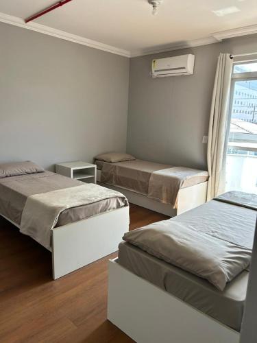 Postelja oz. postelje v sobi nastanitve Sunset Inn