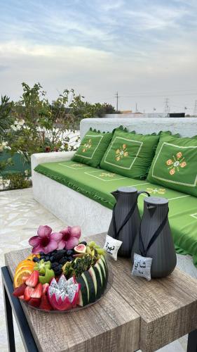 a table with a plate of food on top at مزرعه فلج المعلا in Falaj al Mu‘allá