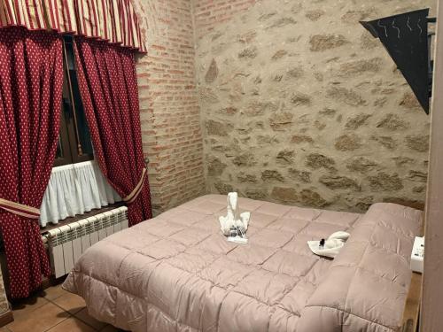 Кровать или кровати в номере Crismar Hotel Rural Arribes del Duero