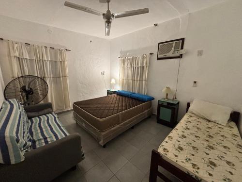 En eller flere senge i et værelse på Casa en Paso de la Patria