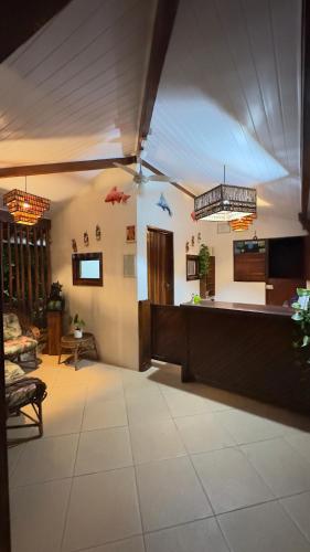 a lobby with a bar in a room at Pousada Meu Sossego in Barra Grande