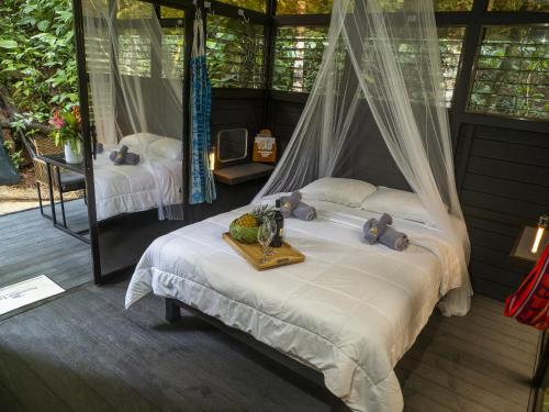 Postel nebo postele na pokoji v ubytování Jungle Loft