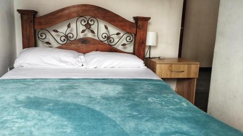 Ένα ή περισσότερα κρεβάτια σε δωμάτιο στο Mammamia CasaHotel