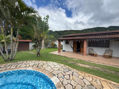 Billede fra billedgalleriet på Casa com Espaço Gourmet e Piscina a 2min da Praia i Caraguatatuba