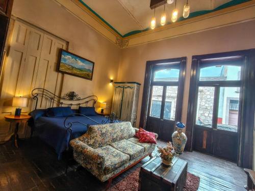 Ένα ή περισσότερα κρεβάτια σε δωμάτιο στο Villa Catrina