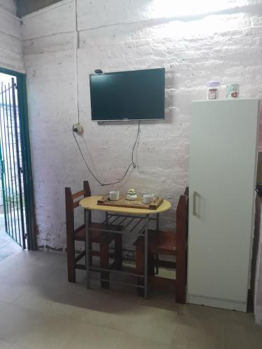 Μια τηλεόραση ή/και κέντρο ψυχαγωγίας στο El Rincón del Capibara Alojamientos