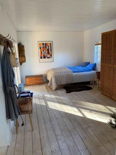 Ένα ή περισσότερα κρεβάτια σε δωμάτιο στο Nordisk Sommerhus I Nykøbing Sjælland