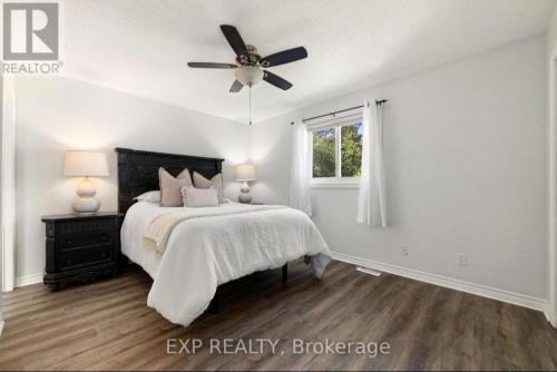 a bedroom with a bed and a ceiling fan at Luxurious home in Belleville in Bélanger