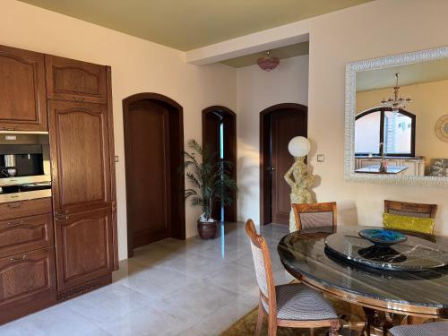 a kitchen and dining room with a table and chairs at R Limoli Vintage in Trávnica