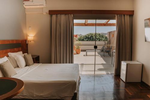 Postel nebo postele na pokoji v ubytování Hotel Amantykir