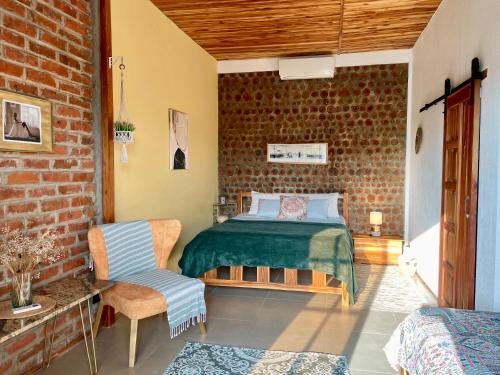 Postel nebo postele na pokoji v ubytování Nativo Lodge Cabaña