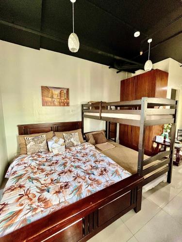 a bedroom with a bunk bed in a room at Affordable staycation at Casa Andrea in Manila