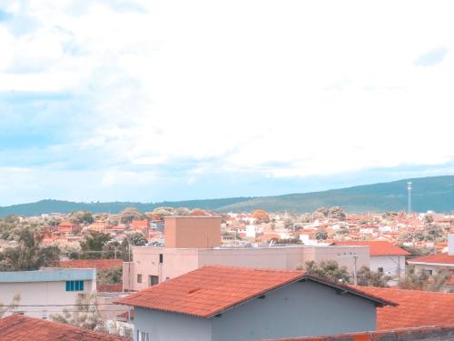 a view of a city with red roofs at Hotel Minas Brasil in Salinas