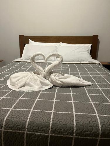 Кровать или кровати в номере Casa Campos do Jordão