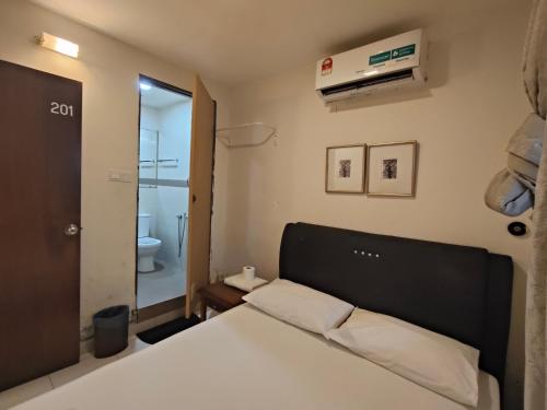 Ένα ή περισσότερα κρεβάτια σε δωμάτιο στο HOTEL NoVA