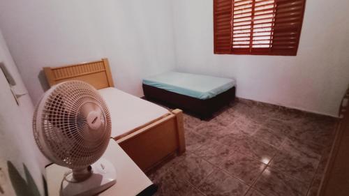 Ένα ή περισσότερα κρεβάτια σε δωμάτιο στο Chácara do vô Meireles