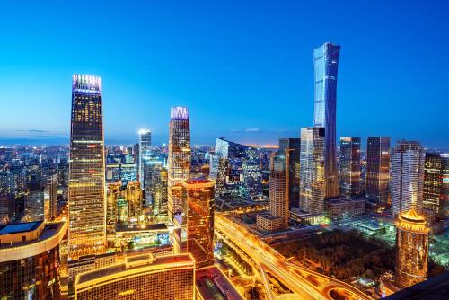 a view of a city at night with traffic at Beijing TangFu Chinese Culture Boutique Hotel Sanlitun Embassy Area in Beijing