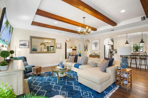 a living room with a couch and a table at Spanish 4BR Compound w Casita & Private Yard in West Palm Beach