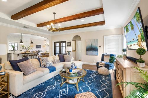 a living room with a couch and a table at Spanish 4BR Compound w Casita & Private Yard in West Palm Beach