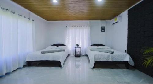 Ένα ή περισσότερα κρεβάτια σε δωμάτιο στο Cabaña Los Ángeles, Fortuna