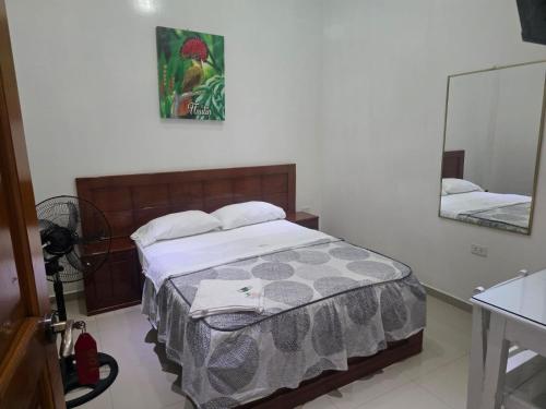 Ένα ή περισσότερα κρεβάτια σε δωμάτιο στο Hospedaje Paraíso