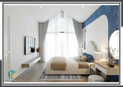 a bedroom with a bed and a large window at Villa Malibu Tropicana Hồ Tràm in Xuyên Mộc