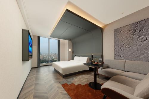 Postel nebo postele na pokoji v ubytování Atour S Hotel Wuhan Mixc Xinhua Road