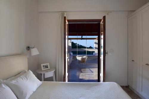 Ένα ή περισσότερα κρεβάτια σε δωμάτιο στο Vista Petros