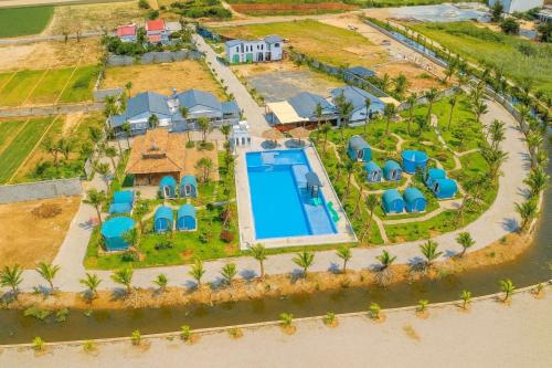 an aerial view of a villa with a swimming pool at Happy Garden Hồ Tràm in Ho Tram