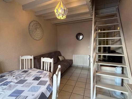 a living room with a bed and a couch at Charmant T3 au cœur du village pour 5 personnes - FR-1-761-31 in Villard-de-Lans