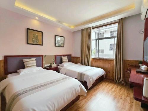 En eller flere senge i et værelse på January Inn