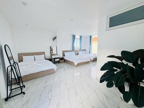 Ein Bett oder Betten in einem Zimmer der Unterkunft Sunrise Guest House