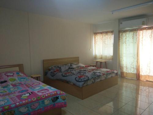 Postel nebo postele na pokoji v ubytování The Prince Residence , Chiang Rai