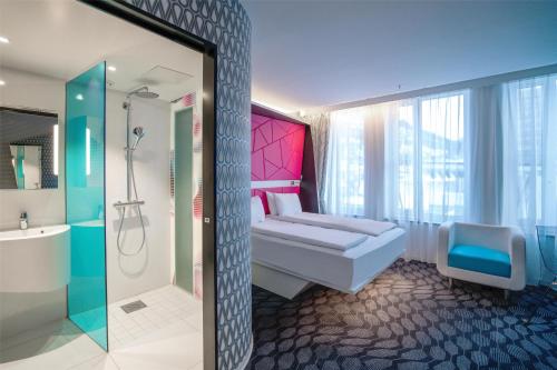 a bathroom with a toilet and a shower and a sink at Prize by Radisson, Xhibition Bergen City in Bergen