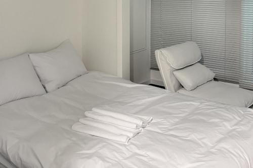 Giường trong phòng chung tại 스테이머물다 event suite