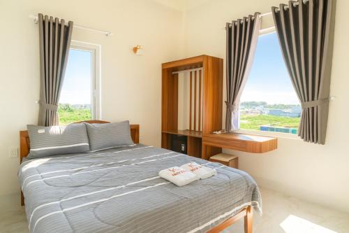 Ένα ή περισσότερα κρεβάτια σε δωμάτιο στο K Hotel Phú Quý