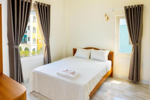 Ένα ή περισσότερα κρεβάτια σε δωμάτιο στο K Hotel Phú Quý