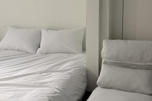 Postel nebo postele na pokoji v ubytování 스테이머물다 event suite