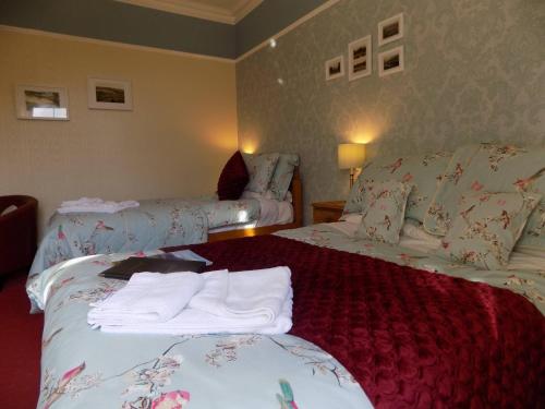 Ένα ή περισσότερα κρεβάτια σε δωμάτιο στο Glendale Guest House