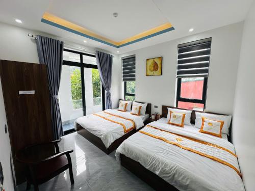 Ένα ή περισσότερα κρεβάτια σε δωμάτιο στο TAM GIAC MACH Hotel