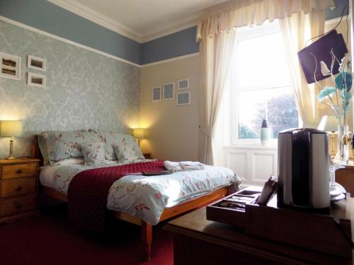 Ένα ή περισσότερα κρεβάτια σε δωμάτιο στο Glendale Guest House