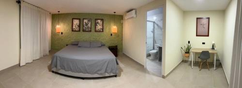 Ένα ή περισσότερα κρεβάτια σε δωμάτιο στο Hojarasca Lodge