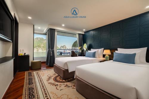 En eller flere senge i et værelse på Aqua Luxury Cruise by AHG