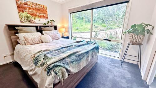 En eller flere senge i et værelse på Ukiyo Coastal Retreat