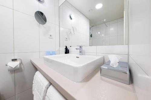 Un baño de Vienna House Easy by Wyndham Vienna Airport