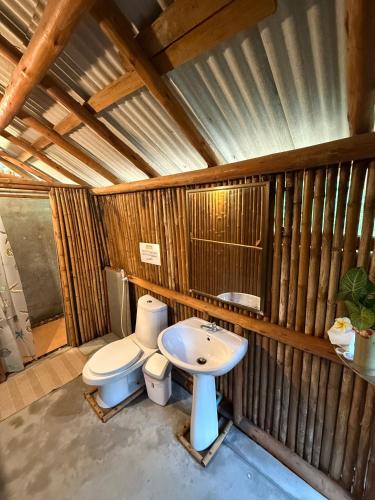 a bathroom with a toilet and a sink at Bamboo Hideaway Resort in Ko Mak