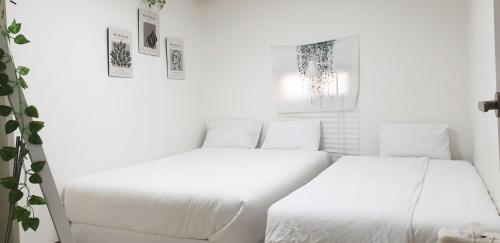 Postel nebo postele na pokoji v ubytování Ulsan stay