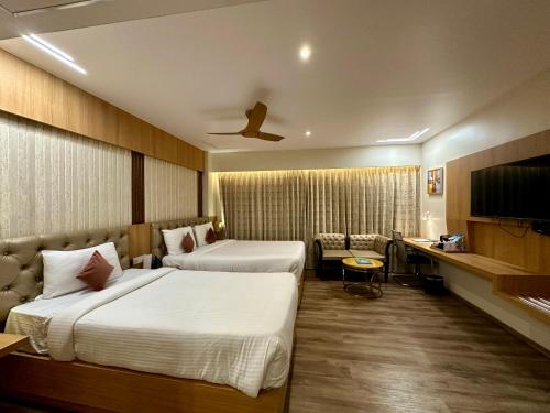 Una cama o camas en una habitación de Hotel Imperial Inn