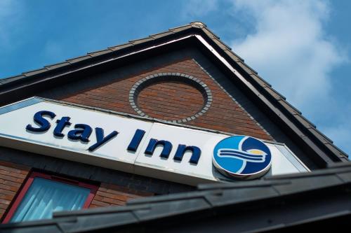 a sign on the side of a building at Stay Inn Manchester in Manchester