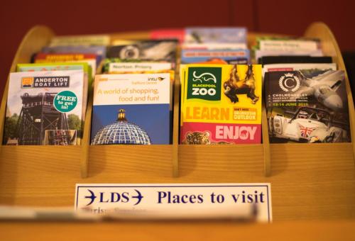 a display of books on a shelf at Stay Inn Manchester in Manchester